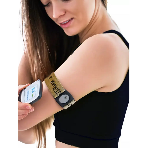 Freestyle Libre 3 Armband Viking Edition worn by a woman, showcasing intricate Viking runes, ensuring sensor security and style.