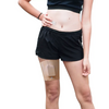 Insulin pump leg band worn by a person, showcasing a discreet and comfortable fit.