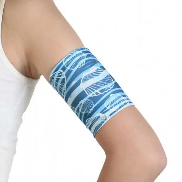 Kids glucose sensor armband with sea-themed design, secure fit for sports activities.