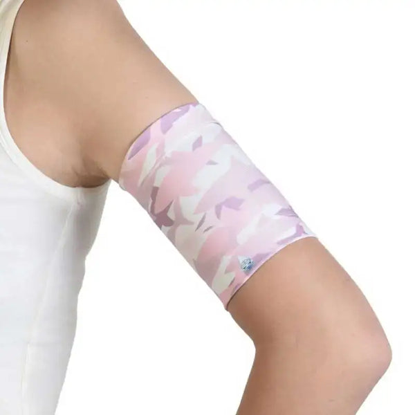 Glucose sensor armband for kids with sea-themed design.