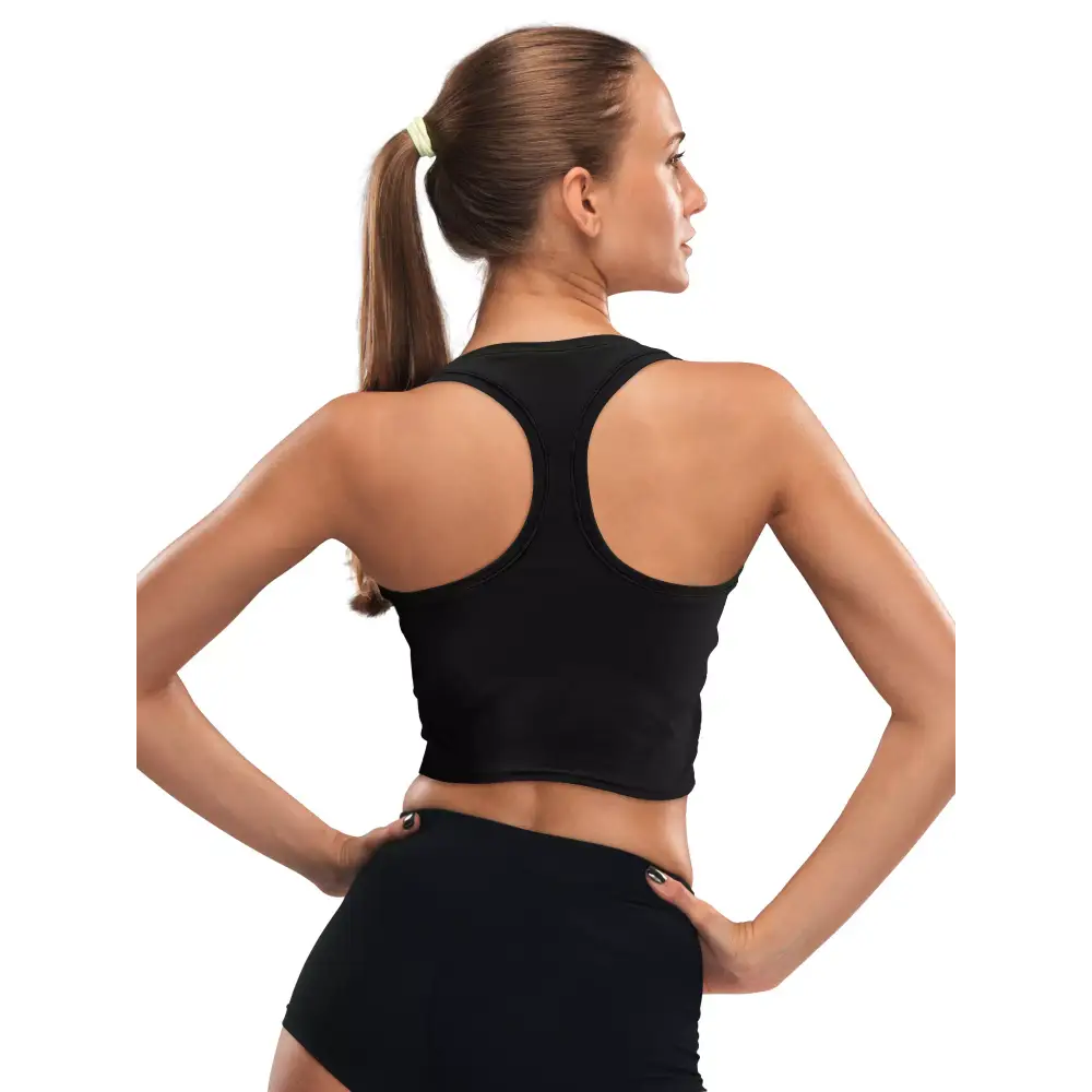 Woman wearing black crop top designed for insulin pump with integrated pockets, showcasing back view.