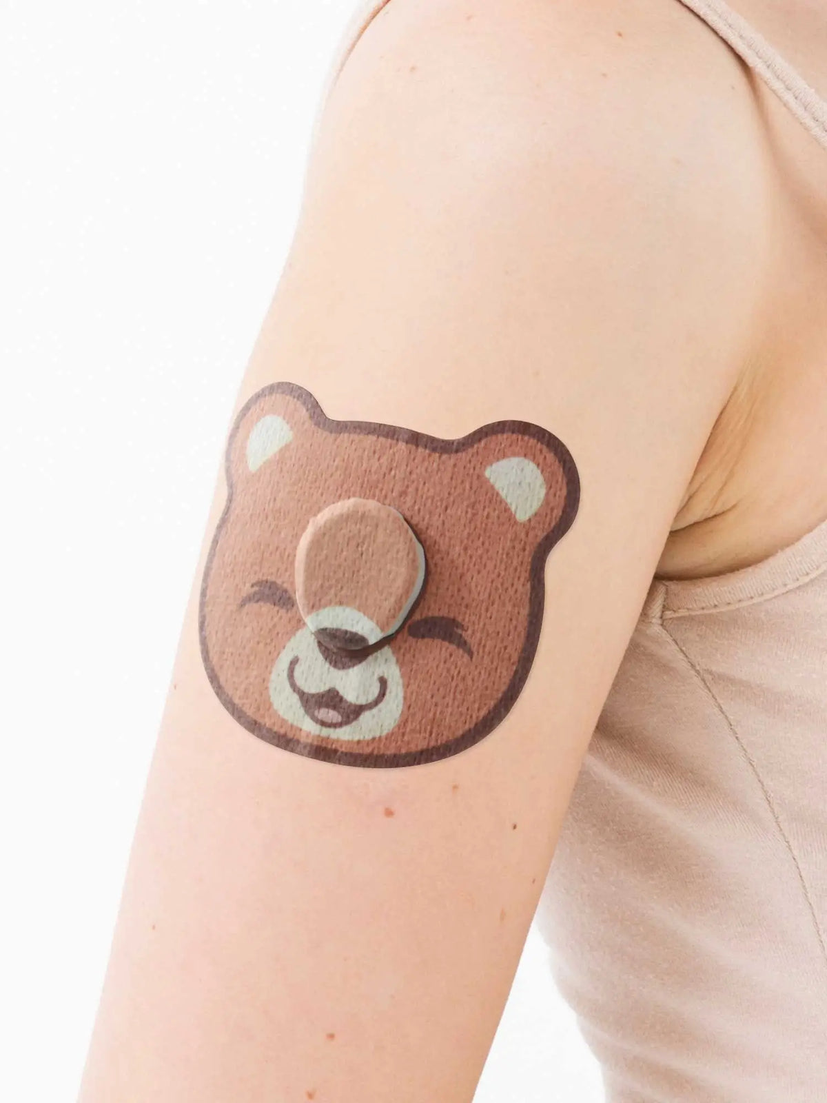 Patch adhésif enfant Dexcom G7, forme ourson, sur le bras