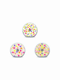 Three Accu-Chek SmartGuide sensor stickers with colorful buds, flowers and garden-inspired patterns on white.