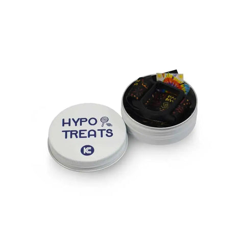 GlucoMen Day CGM adjustable armband with colorful designs stored in a reusable hypo treats tin box including 3 decorative stickers