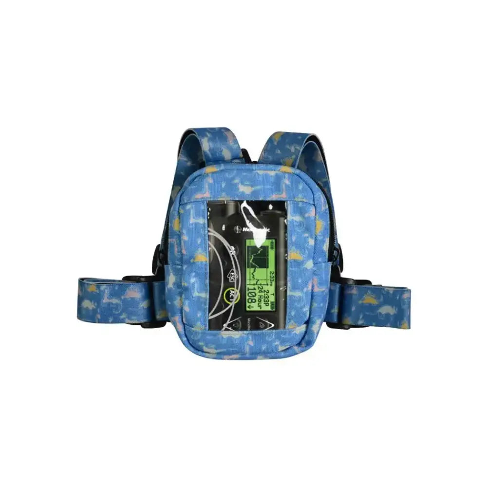 Insulin pump harness with window for children, blue design, adjustable straps, pocket for easy access.