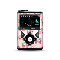 Medtronic MiniMed insulin pump with Valentine 2025 sticker, floral design.