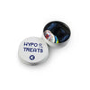 A tin container labeled "HYPO TREATS" with a few candies visible inside, designed for people managing hypoglycemia