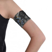 Narrow Diabetic Sensor Armband on upper arm, breathable fabric, secure for glucose sensors, ideal for sports or swimming.