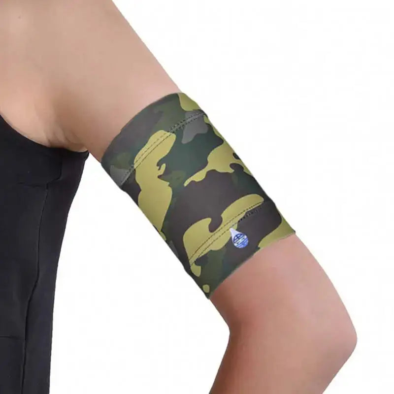 Trendy diabetic armband holding glucose sensor on upper arm in camouflage design.