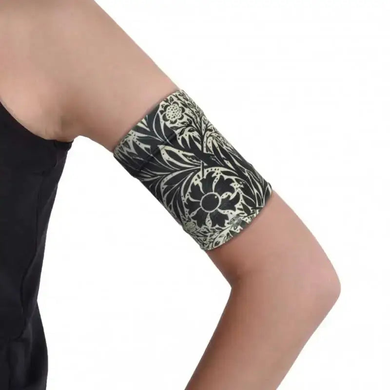 Stylish Dia-Band armband with dark printed design for glucose sensor protection.